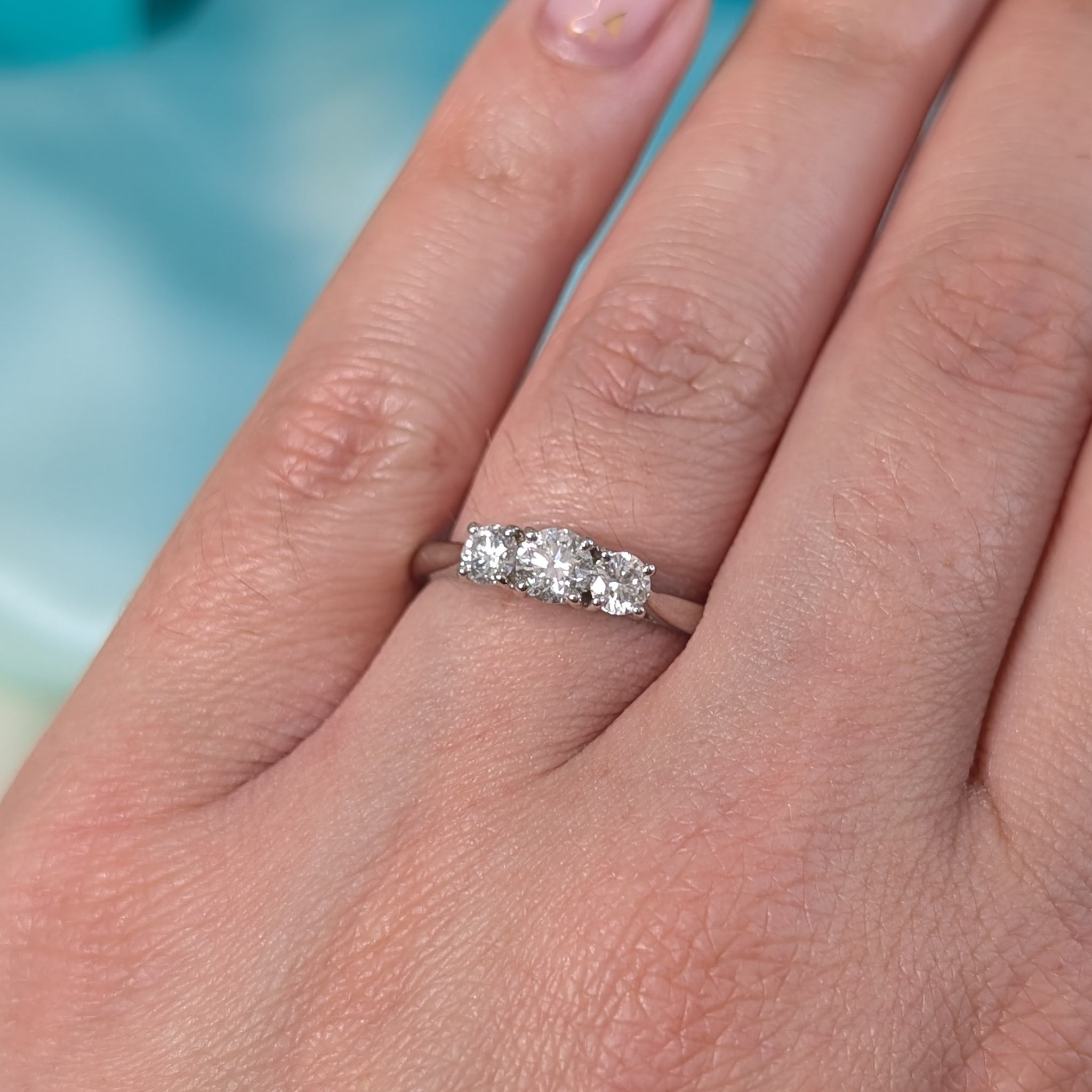 Brilliant cut diamond three stone ring in platinum, 0.75ct