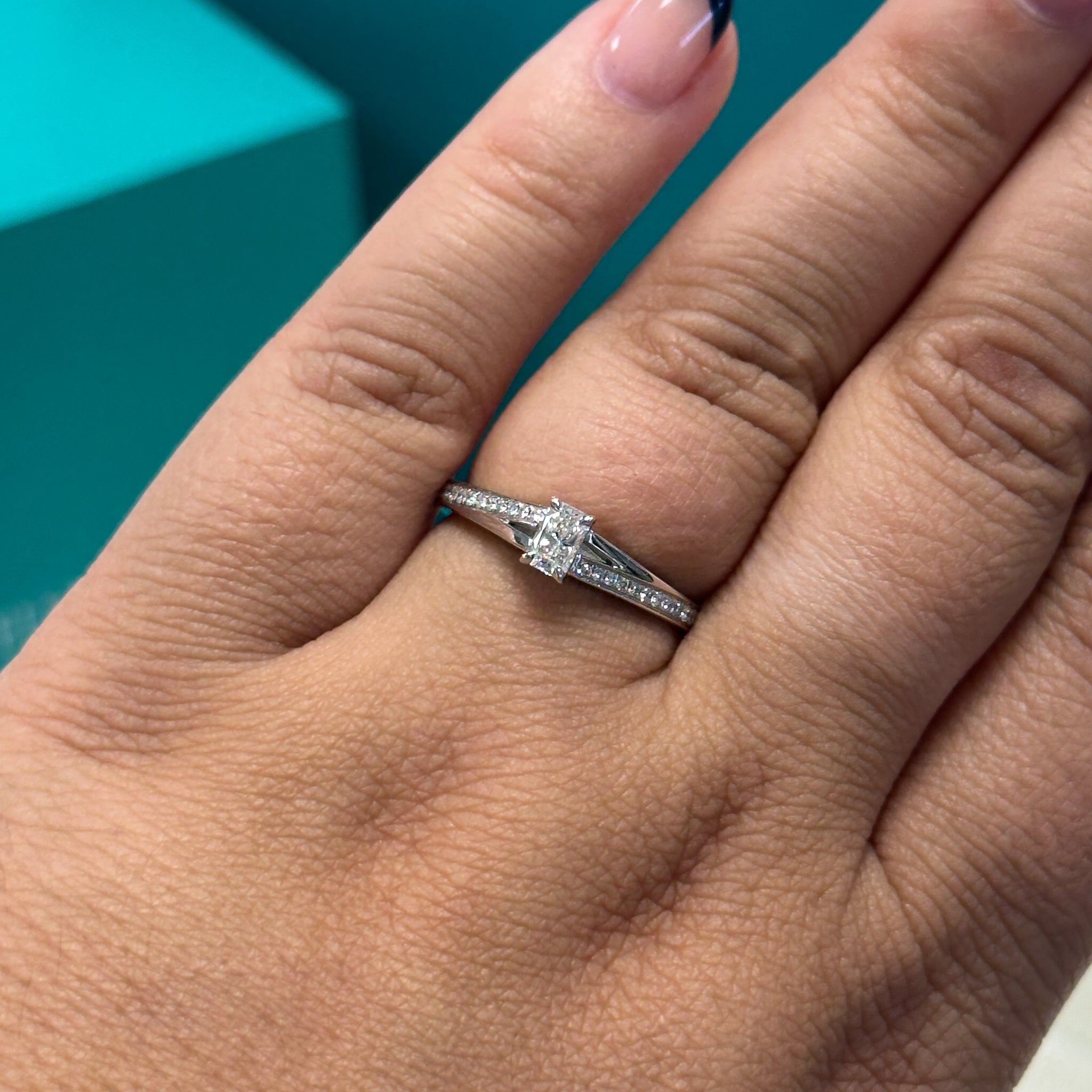 Phoenix cut diamond solitaire with diamond set shoulders in 18ct white gold, 0.33ct