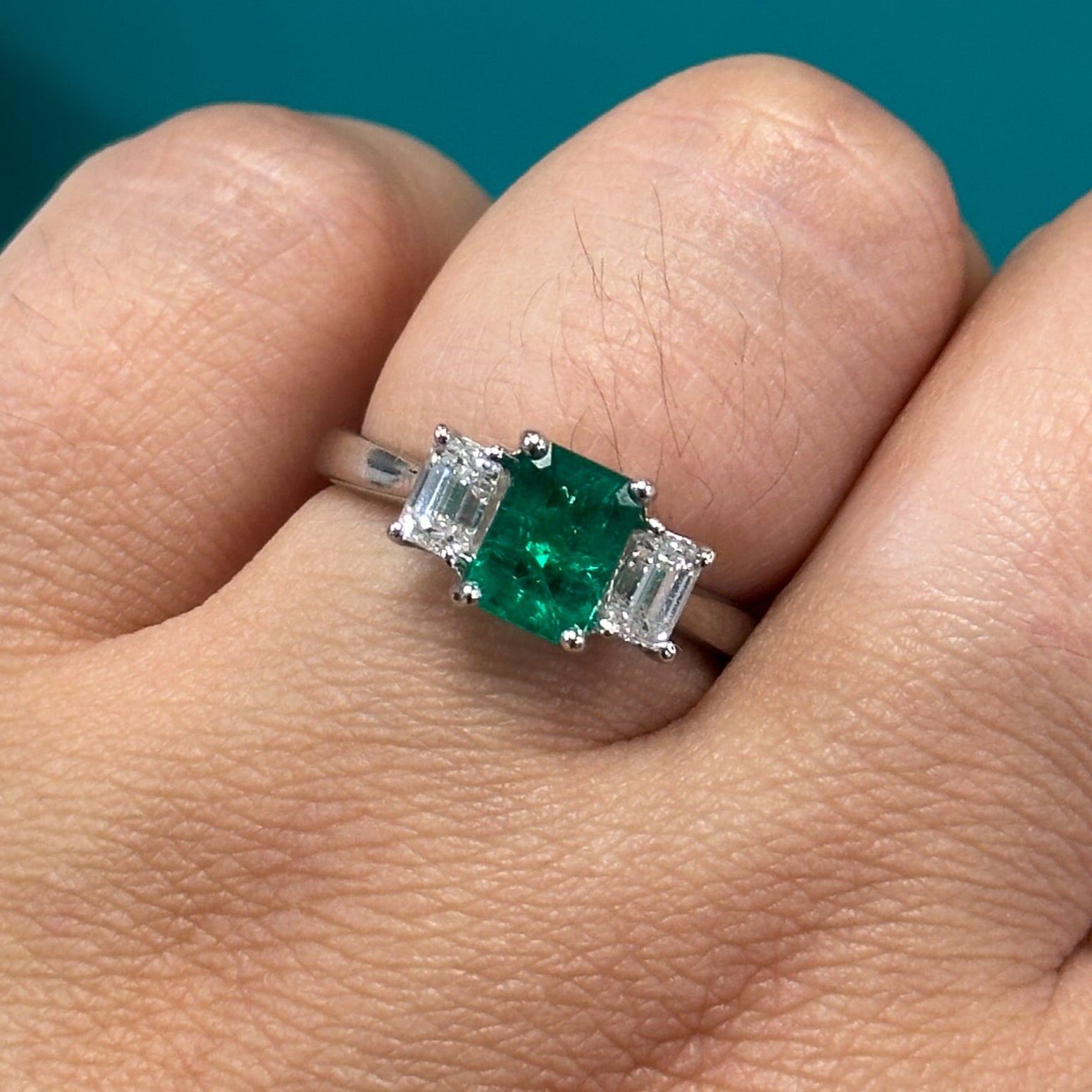 Emerald & diamond three stone ring in Platinum