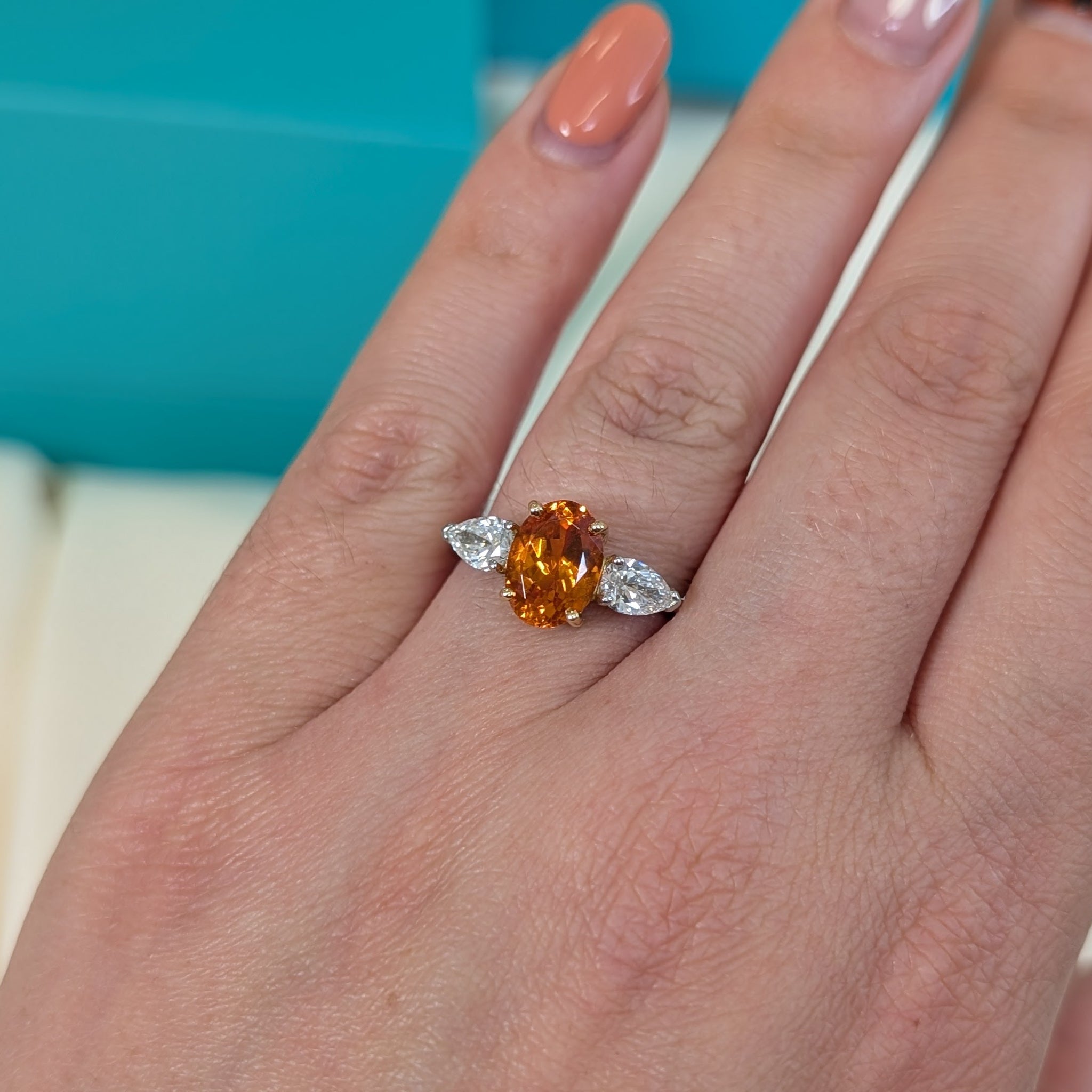 Mandarin garnet and diamond three stone ring in platinum and 18ct gold