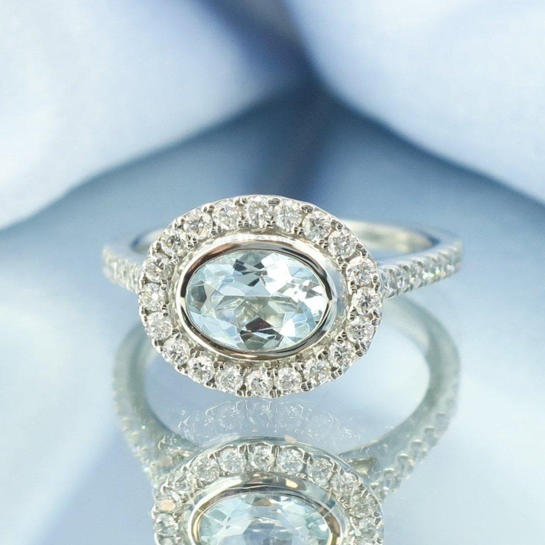 Aquamarine and Diamond Halo Cluster Ring in Platinum | 0.60ct