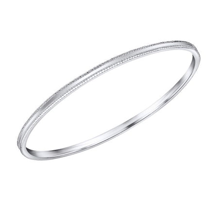 Mill grain edge bangle in silver.
