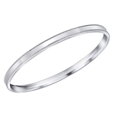 Mill grain edge bangle in silver.