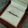 Emerald cut diamond solitaire ring in platinum, 0.93ct
