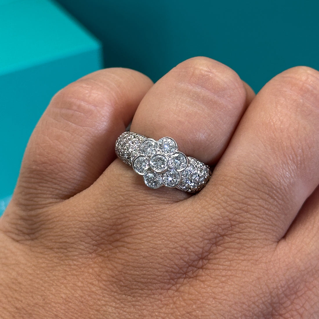 Diamond floral cluster ring with diamond set shoulders in 18ct white gold, 1.70ct