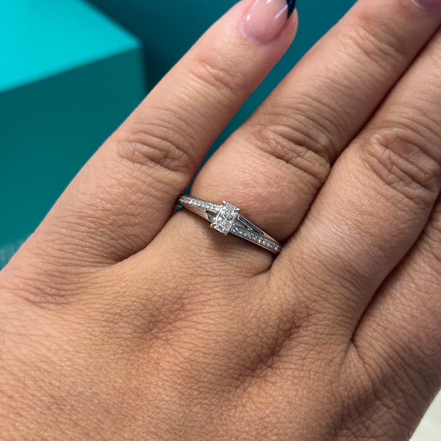 Phoenix cut diamond solitaire with diamond set shoulders in 18ct white gold, 0.33ct