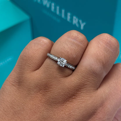 Diamond ring with diamond set shoulders in 18ct white gold, 0.61ct