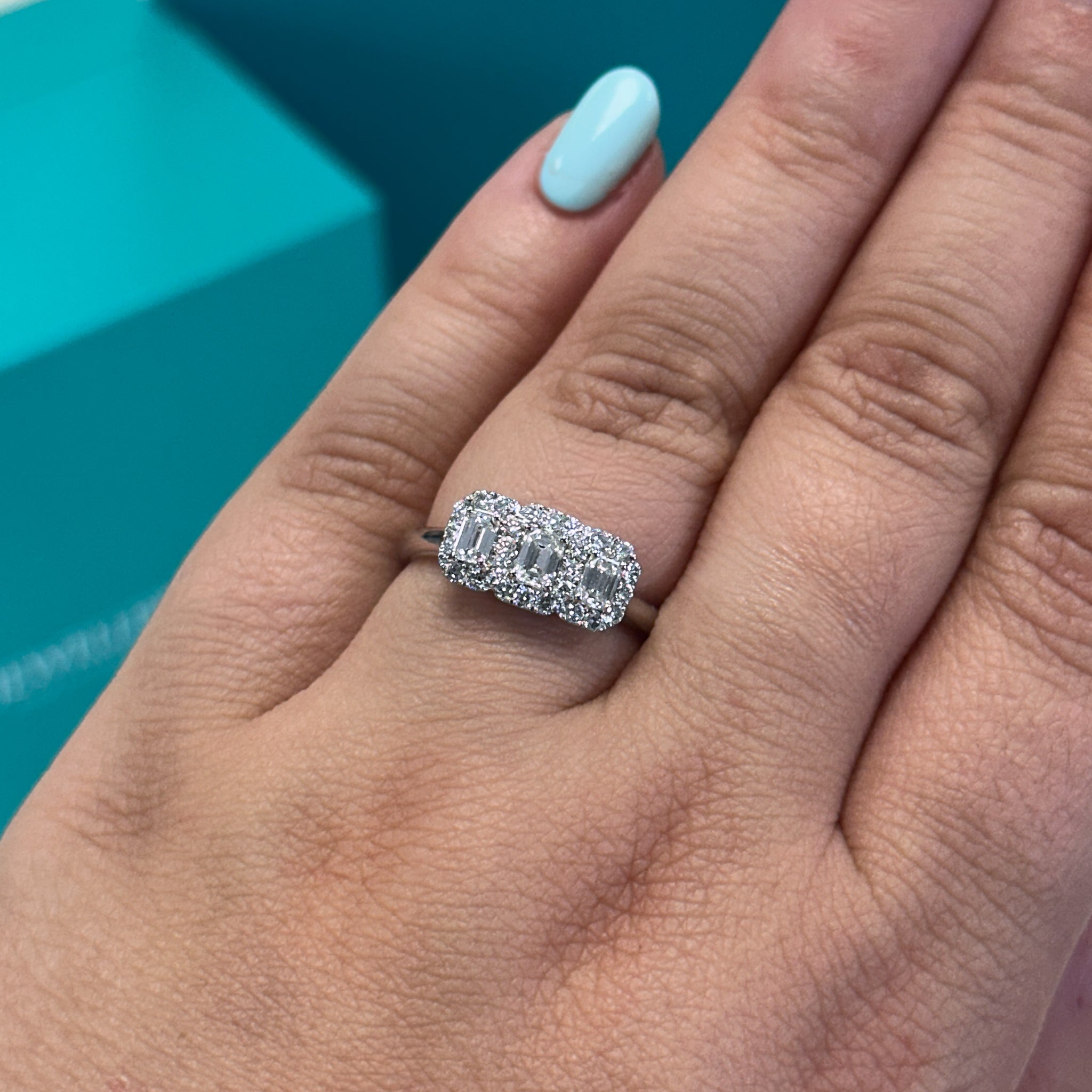 Emerald cut diamond triple halo cluster ring in platinum, 0.77ct