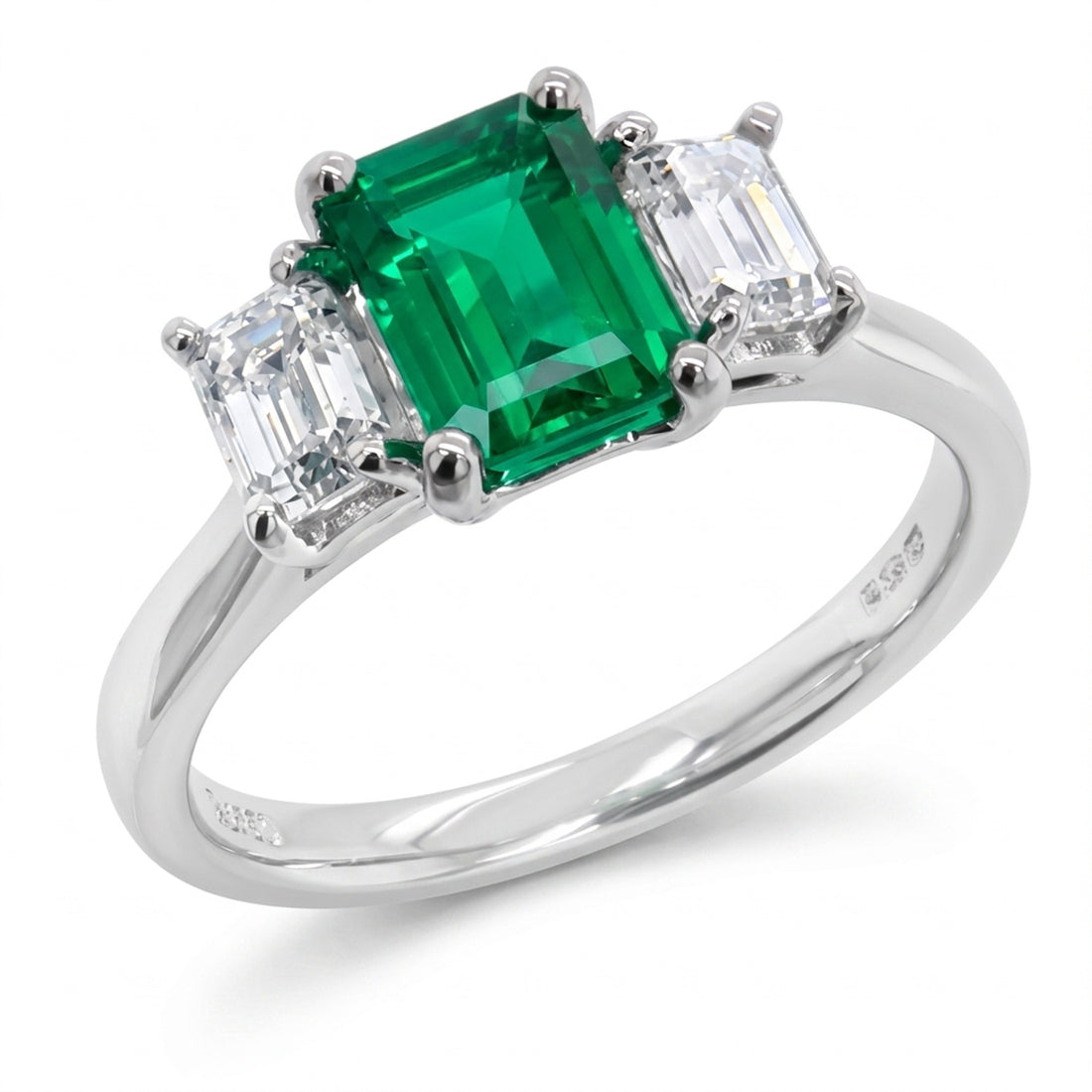 Emerald &amp; diamond three stone ring in Platinum