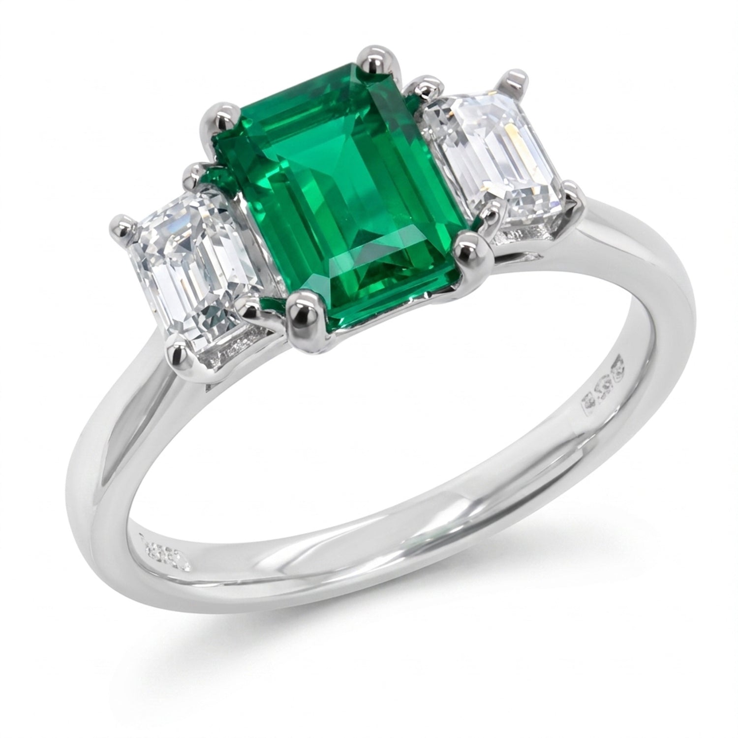 Emerald &amp; diamond three stone ring in Platinum