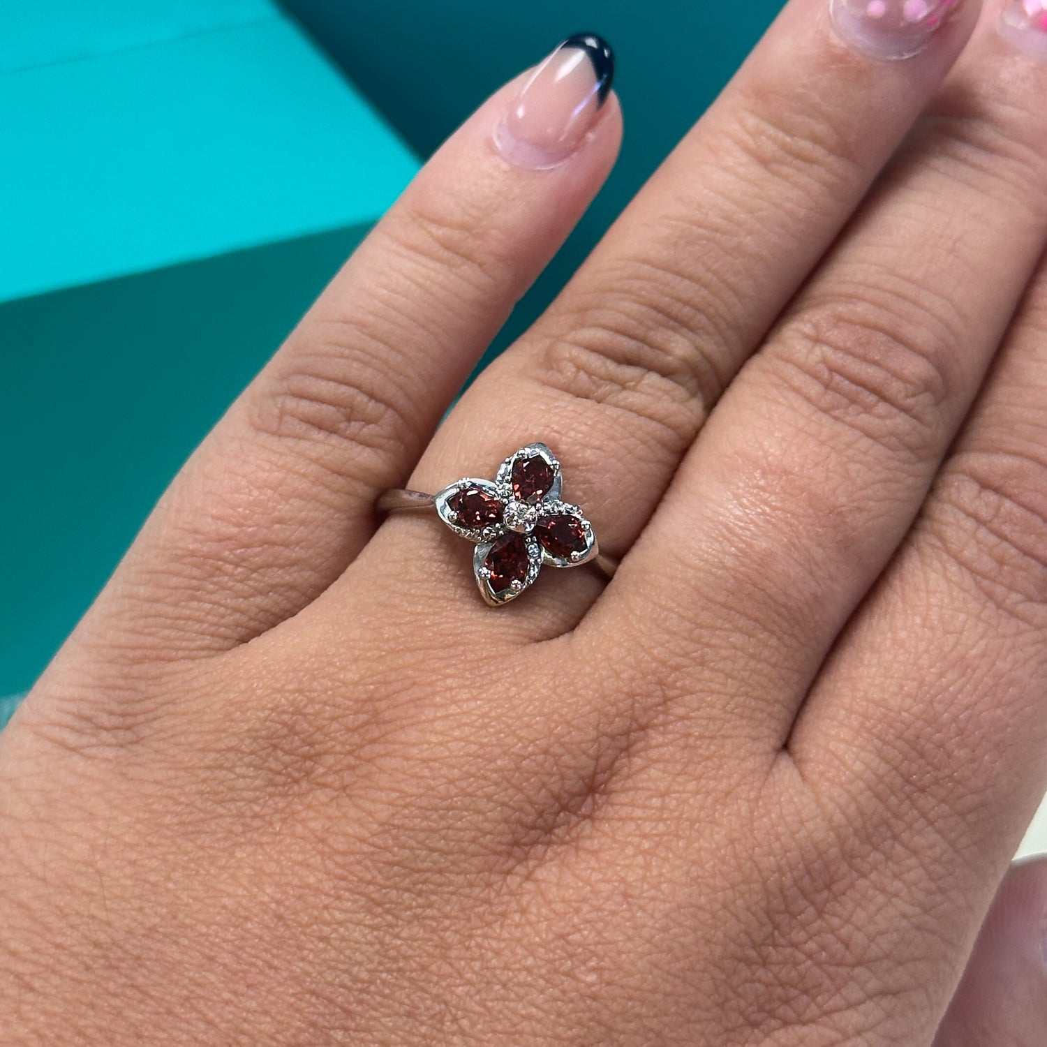 Garnet and diamond floral dress ring in 9ct white gold