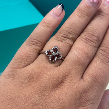 Garnet and diamond floral dress ring in 9ct white gold