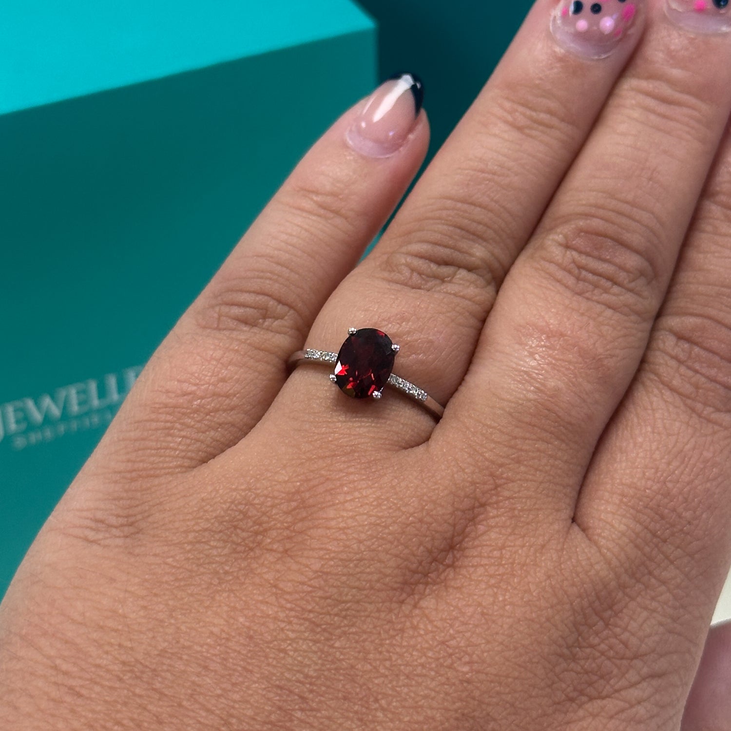 Garnet and diamond ring in 9ct white gold
