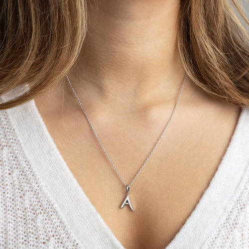 Kit Heath Signature Skript Initial Necklace in Silver.