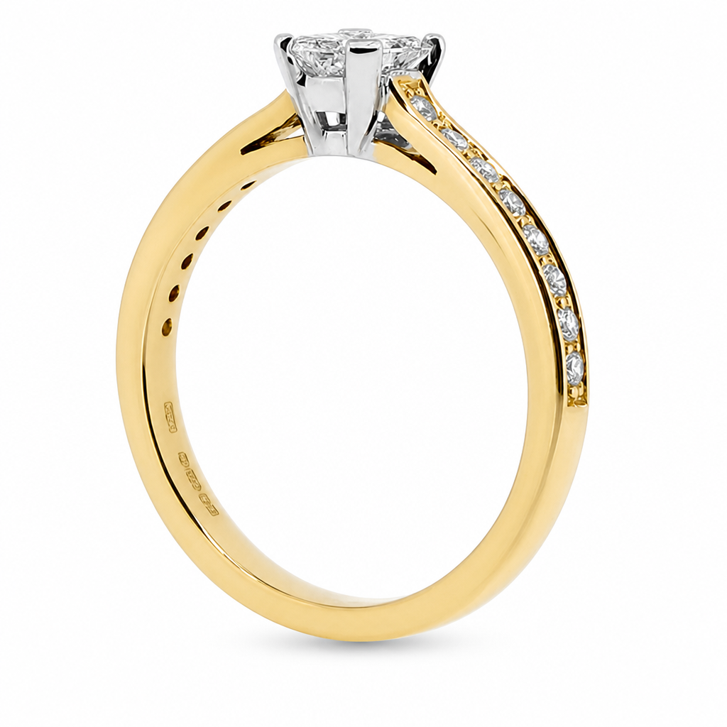 Phoenix cut diamond ring with diamond set shoulders in 18ct yellow gold, 0.72ct