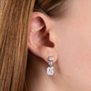 Cubic zirconia three stone drop earrings in silver.