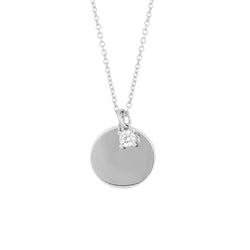 Cubic zirconia solitaire and tag pendant in silver.