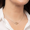 Linked heart necklace in silver with gold plating.