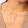 Open heart pendant in silver.