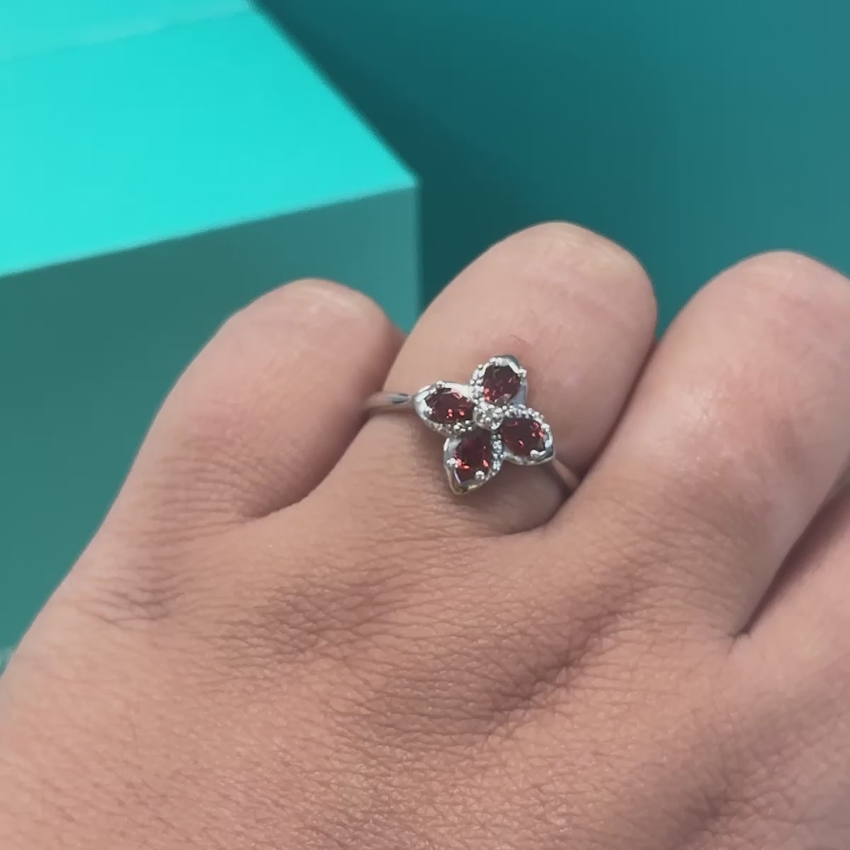 Garnet and diamond floral dress ring in 9ct white gold