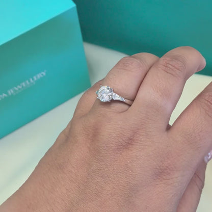 Diamond Solitaire with Tapered Baguette Shoulders in Platinum, 1.57ct