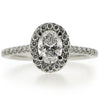 Oval diamond halo cluster ring in platinum, 1.10ct