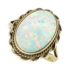 Simulated opal solitaire ring in 9ct gold