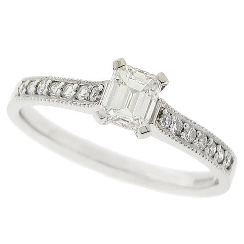 Emerald cut diamond ring with diamond set shoulders in platinum, 0.50ct