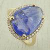 Tanzanite and diamond halo cluster ring in 18ct gold