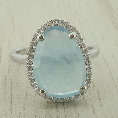 Aquamarine and diamond halo cluster ring in platinum