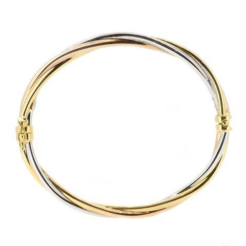 Twisted design hinged bangle in 9ct three colour gold