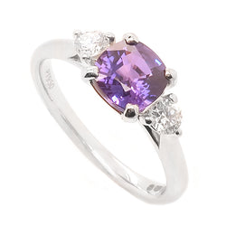 Purple sapphire and diamond three stone ring in platinum
