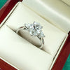 Lab grown oval and pear shape diamond three stone ring in platinum, 1.88ct