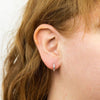 Cubic zirconia hinged octagonal huggie earrings in silver